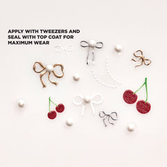 Close-up shot of Salon Perfect Nail Art Stickers Bows and Cherries sticker sheet.