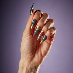 hand shot with SALON PERFECT NAIL 232 BLACK GOLD HEART STILLETO 