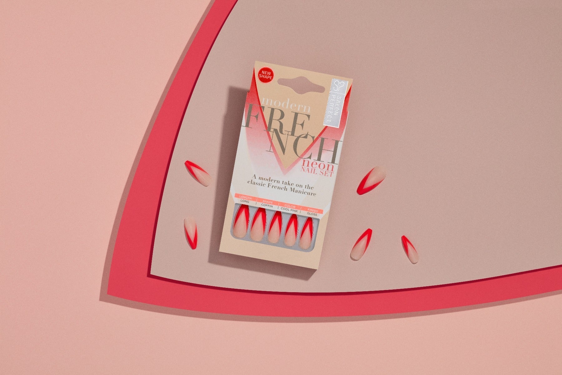 Salon Perfect Modern French Neon Nail Set in a creative flat-lay display with red ombre nails and packaging.